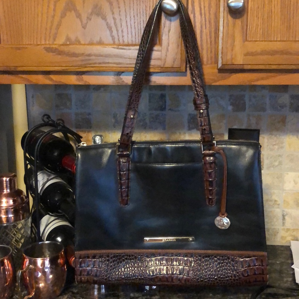 Authentic Brahmin black & brown alligator trim.